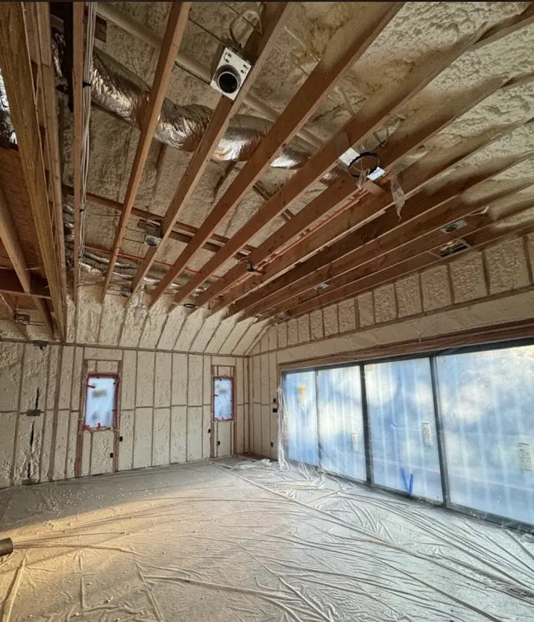 Interior walls and ceiling insulated with spray foam during new construction in Calhoun